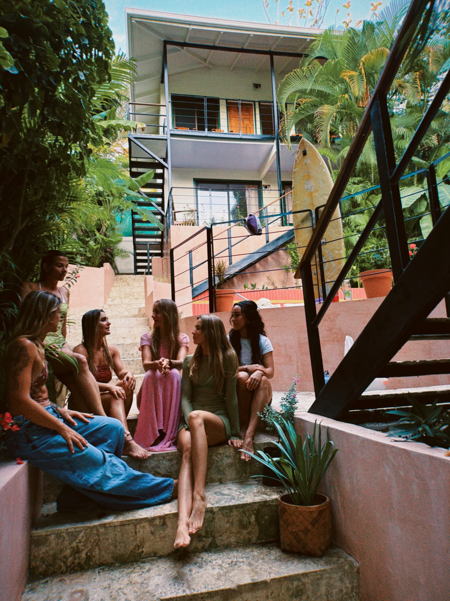 Friends on the pool stairs