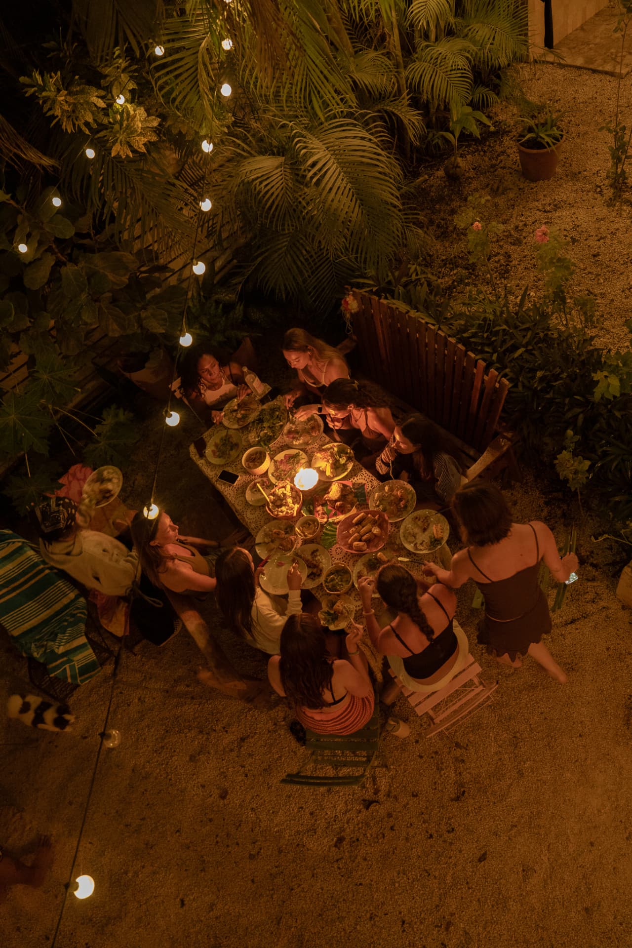 A colorful retreat dinner table in the tropical garden