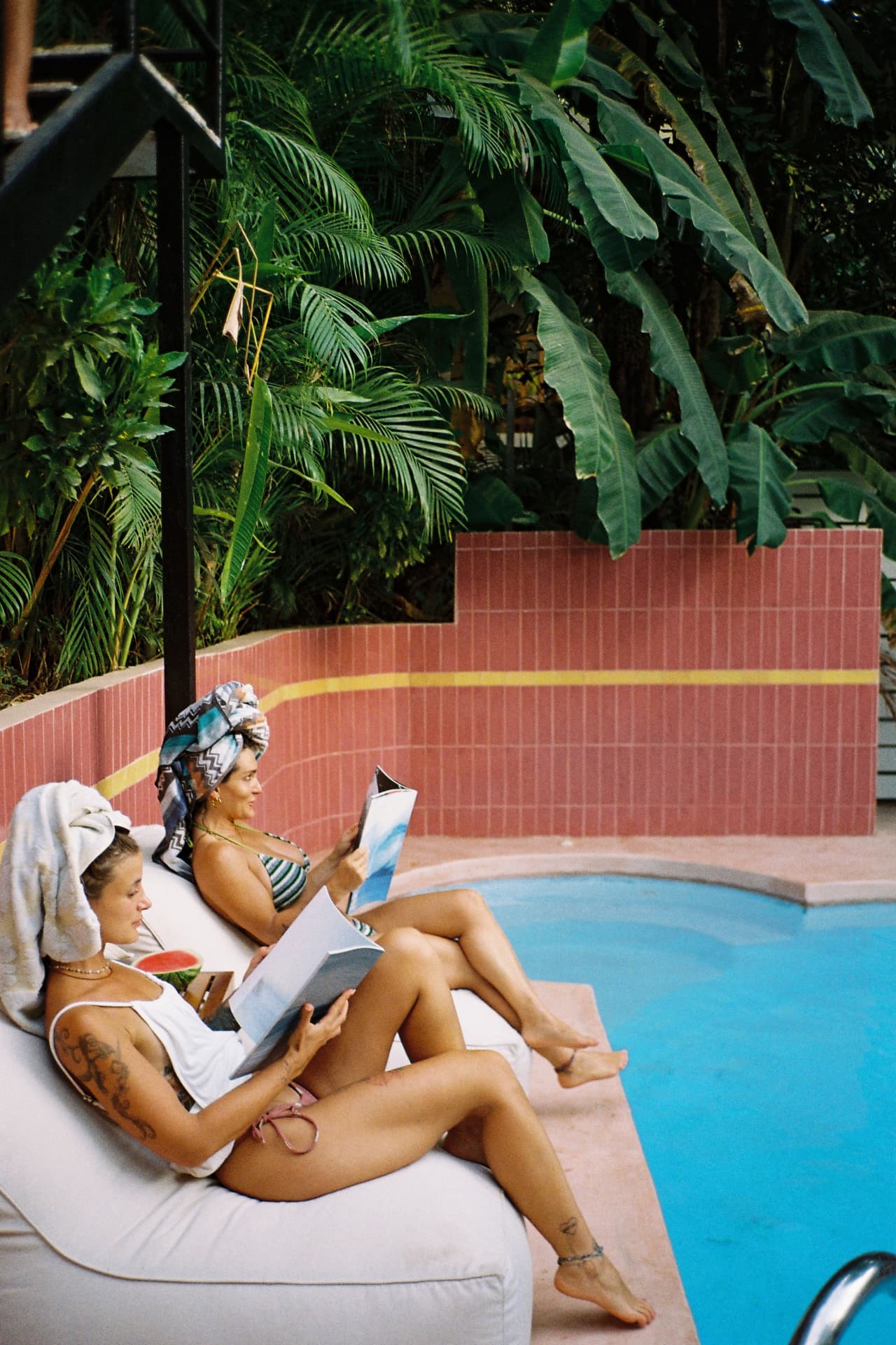 Lounging poolside under the palms