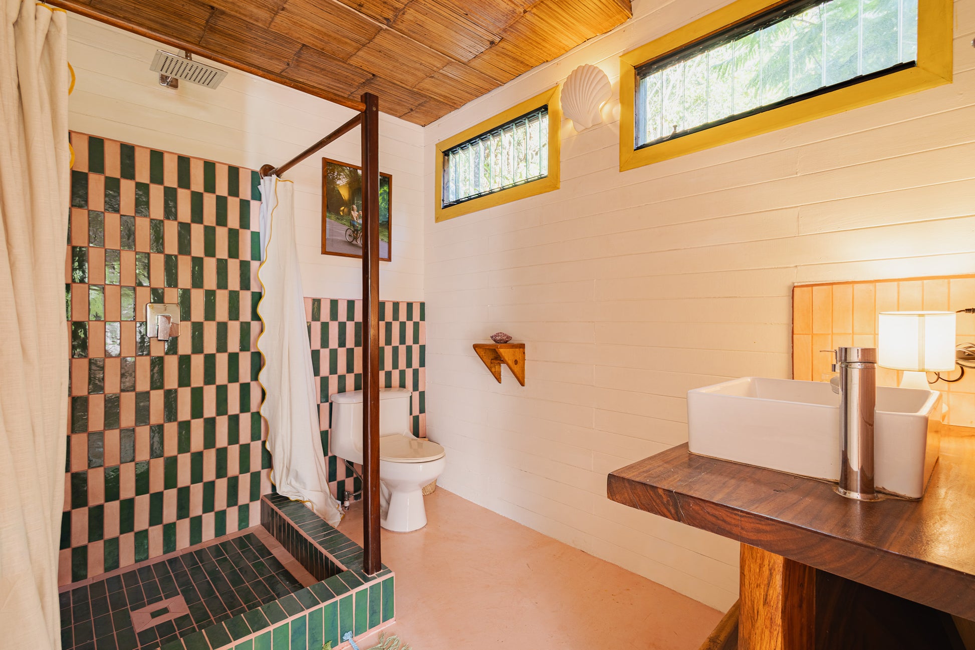 Apartment Piña — Bathroom with green-and-white tiled walk-in shower and wooden vanity